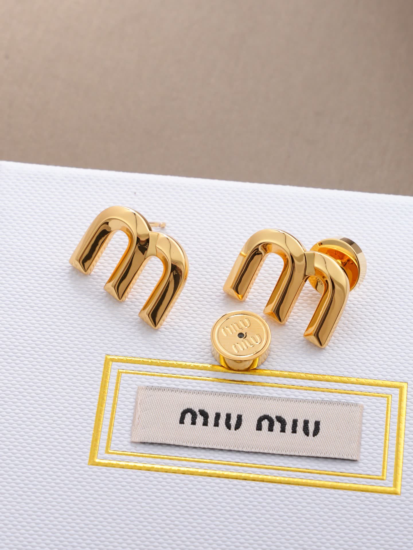 Miu Miu Gold Tone 'M' Stud Earrings